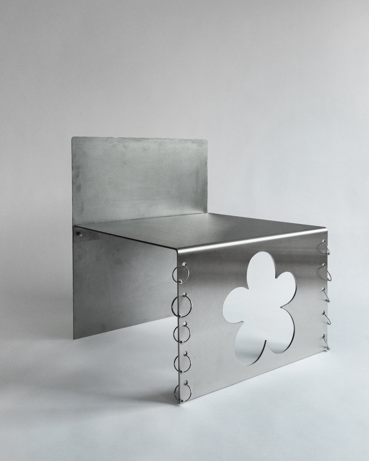 PIERCED COSMIC FLOWER Chair by Laoma Atelier